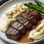steak mashed potatoes with brown gravy and asparagus