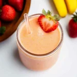 Strawberry mango banana smoothie with garnish