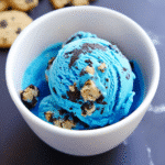 Cookie Monster ice cream with crushed cookies in a white bowl