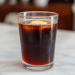 Warm prune juice and butter remedy in a mug