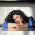 Woman experiencing Zepbound fatigue in kitchen