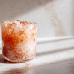 Pink salt morning ritual for weight loss glass on marble counter