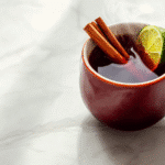 Costa Rican tea recipe for weight loss served hot in a ceramic mug with cinnamon and lime