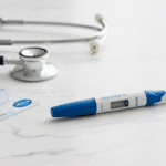 Does Aetna Cover Zepbound? Zepbound injection pen with Aetna card on white marble background