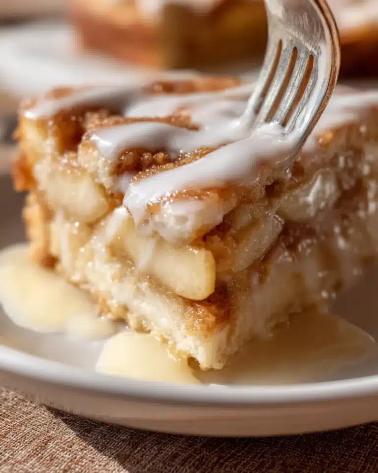 Freshly baked apple slices from the bakery, showcasing juicy apples and golden crust.