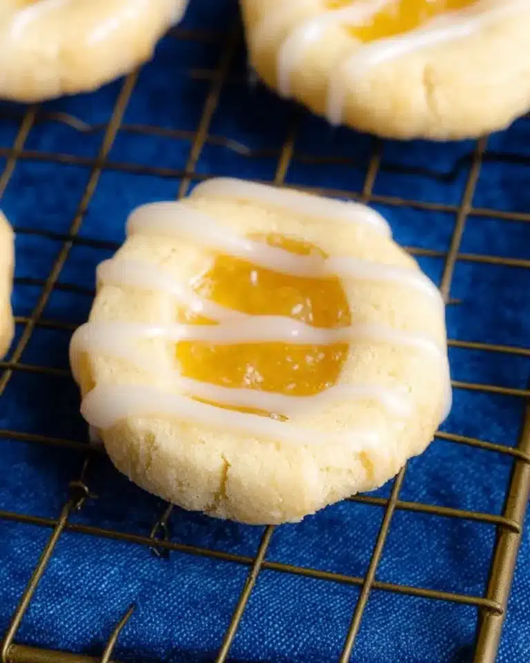 Lemon curd shortbread cookies arranged on a decorative plate