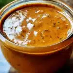 Bottle of Shut Your Mouth Sauce, perfect for enhancing any meal with bold flavors.