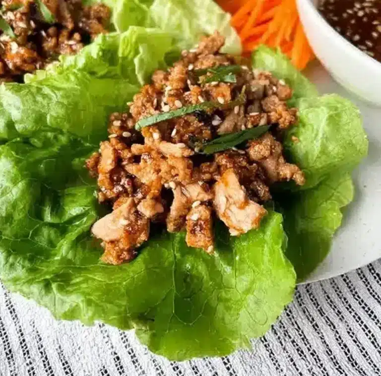 Plate of Chang's Lettuce Wraps garnished with fresh vegetables