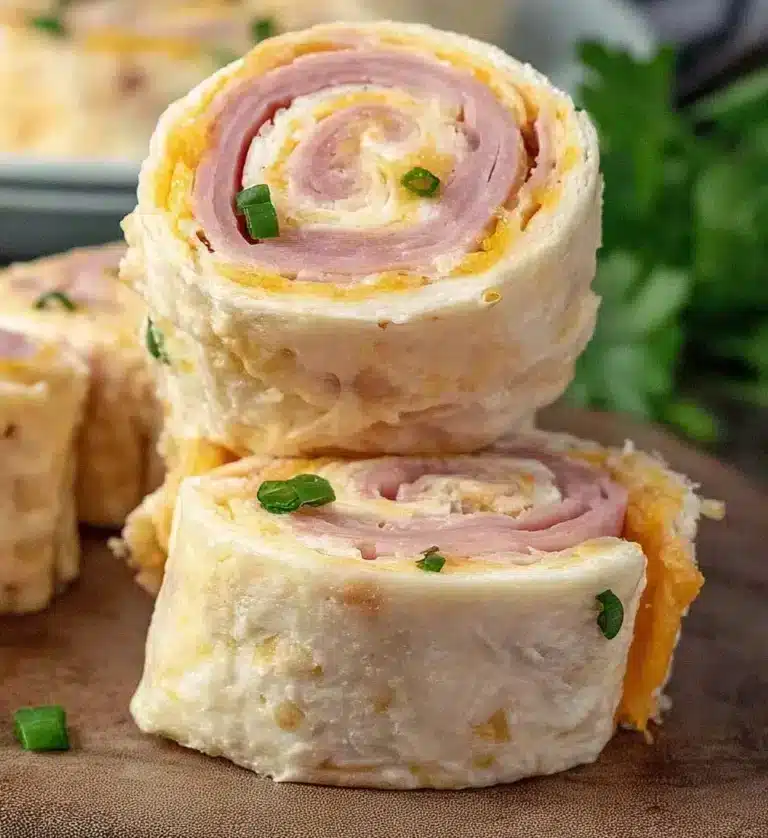 Plate of homemade ham and cheese roll ups served as a tasty snack.