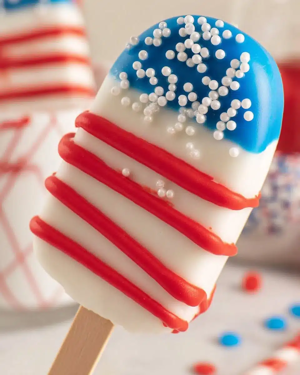 Patriotic cakesicles decorated in red, white, and blue for festive celebrations.