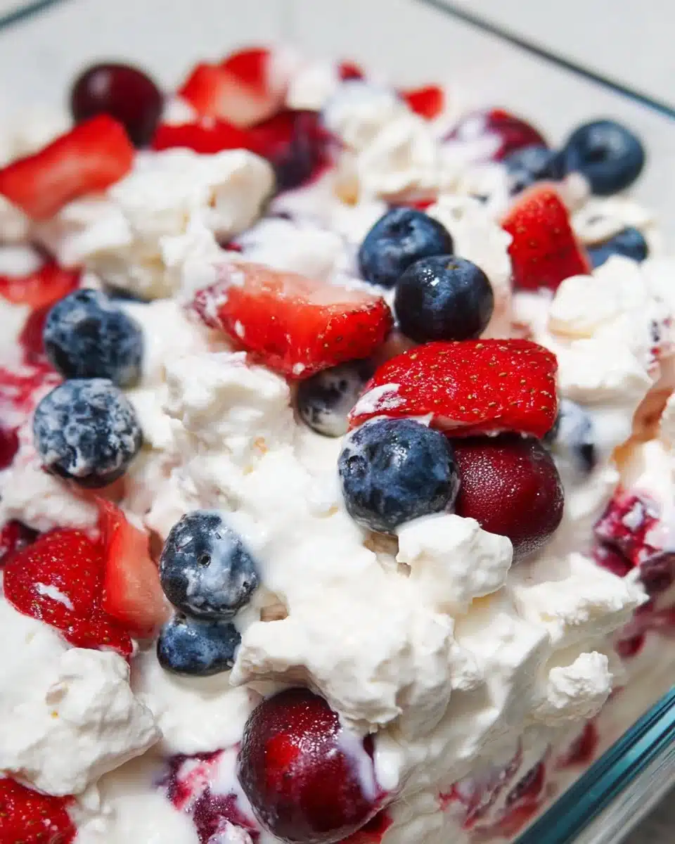 Red, White, and Blue Cheesecake Salad with fresh berries and creamy topping