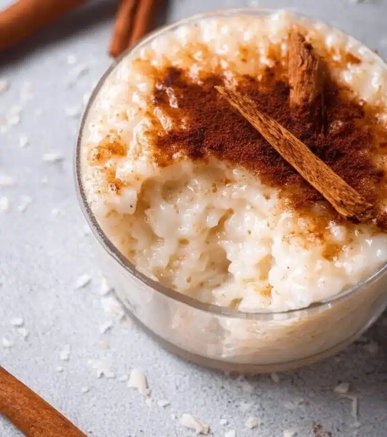 Delicious homemade rice pudding topped with cinnamon and raisins