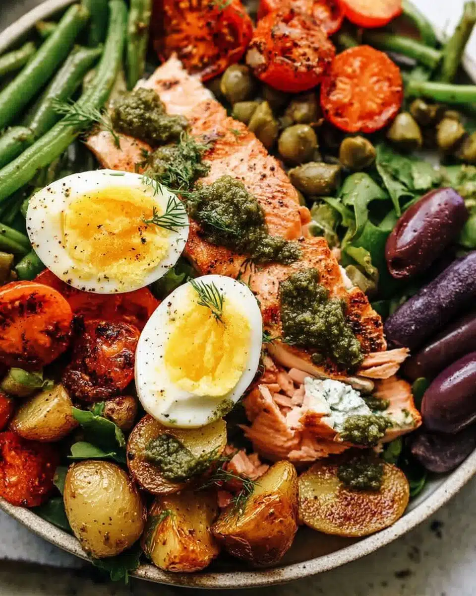 Roasted Salmon Nicoise Salad with fresh vegetables and olives