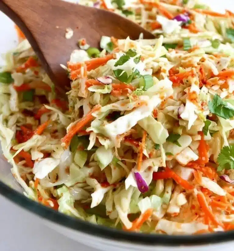Fresh and colorful cabbage salad with vegetables and dressing