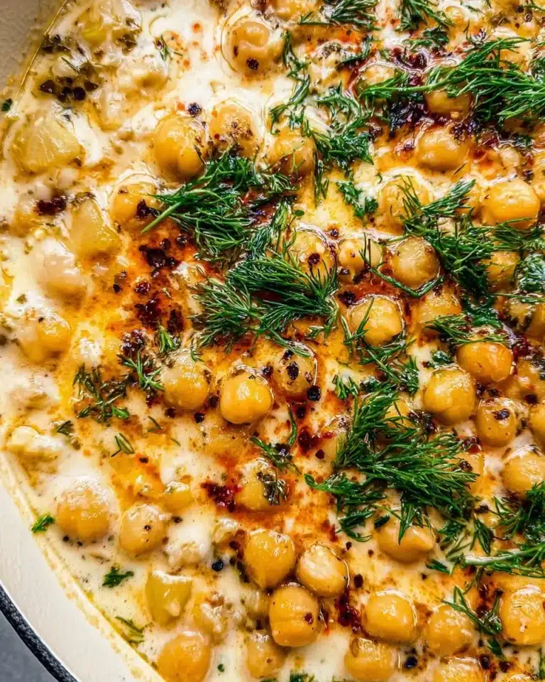 Bowl of delicious Lemon Chickpea Stew garnished with fresh herbs