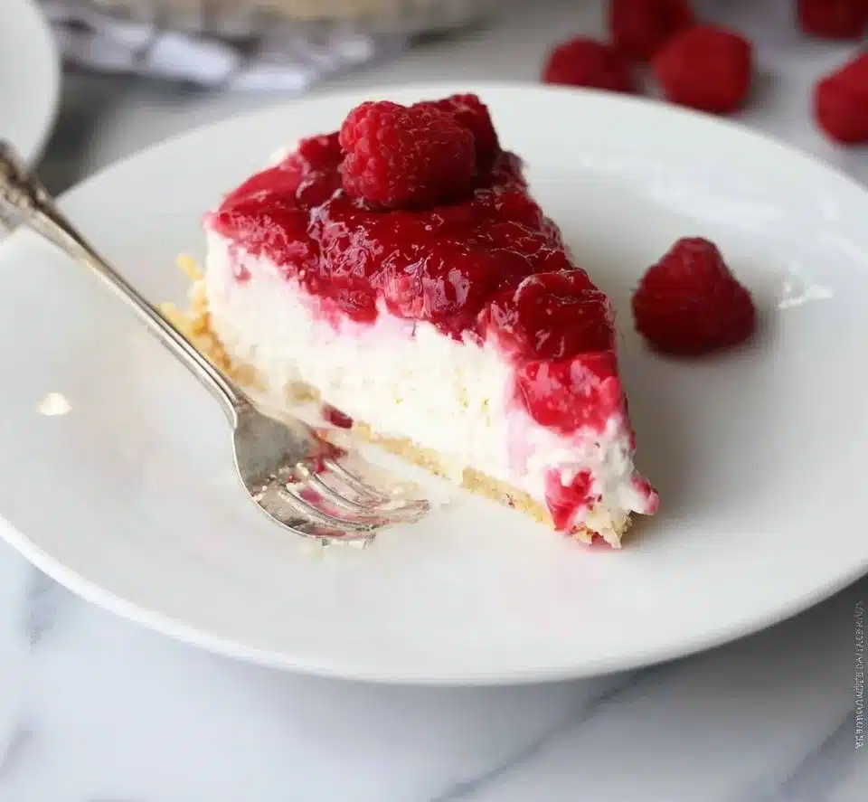 Delicious Raspberry Cream Pie with fresh raspberries on top