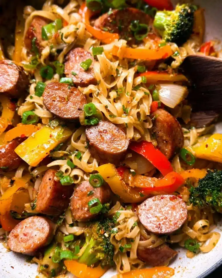 Colorful sausage stir fry with fresh vegetables in a skillet