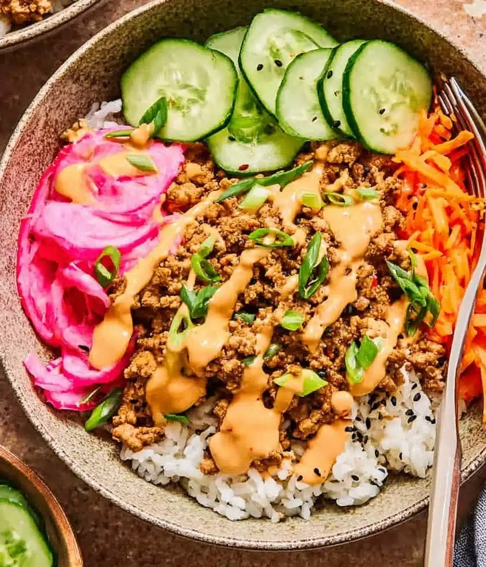 Delicious turkey rice bowls with fresh vegetables and seasonings
