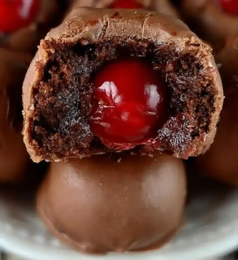 Delicious chocolate covered cherry dessert with a glossy finish.