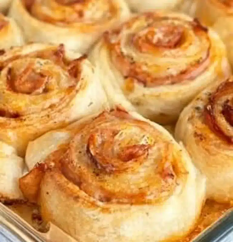Savory ham and cheese pinwheels rolled up and sliced for a tasty appetizer