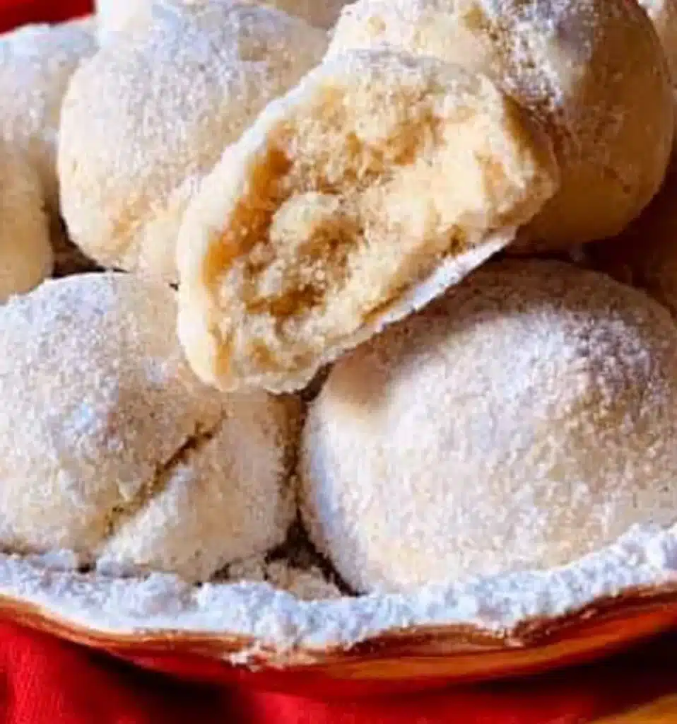 Plate of delicious homemade Snowball Cookies coated in powdered sugar